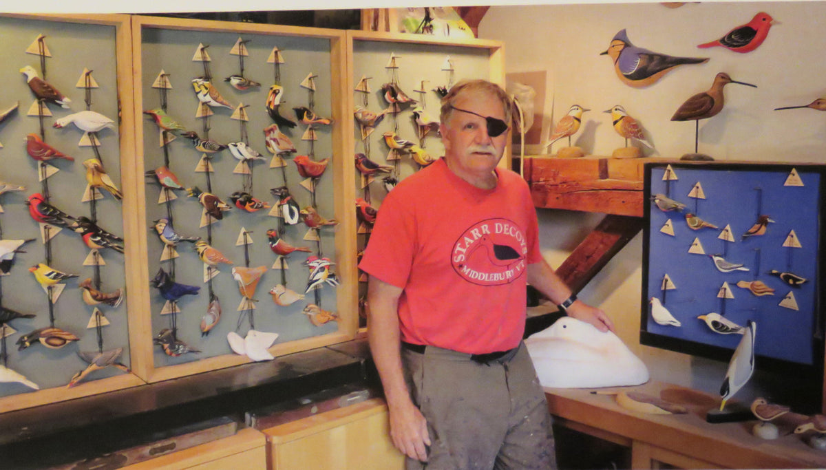 craftsman gary starr stands at a display case